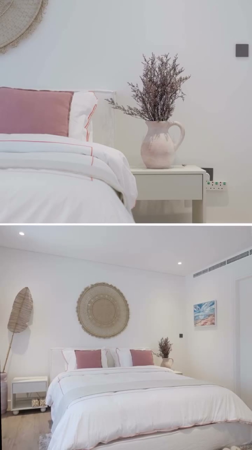 Styled bedroom with soft bedding and decor accents